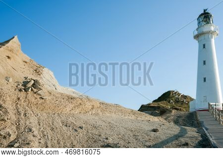 Castle Point Lighthouse And Coastline On Wairarapa Coast In New Zealand.