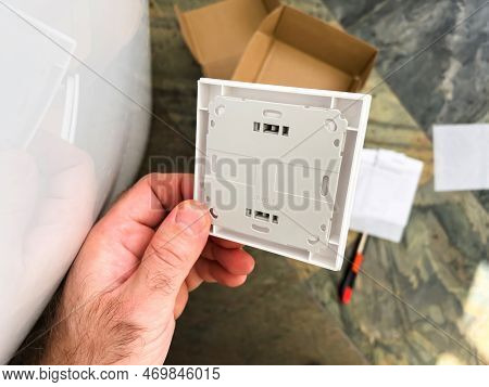 London, United Kingdom - Jan 1, 2022: Close-up Male Hand Holding New Vaillant Vr51 Room Thermostat B