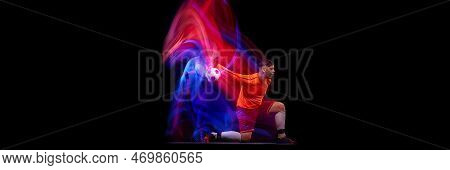 Sportive Energetic Man, Soccer Football Goalkeeper In Action, Motion Over Dark Background With Mixed