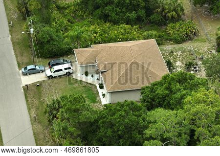 Aerial View Of Typical Contemporary American Private House With Roof Top Covered With Asphalt Shingl