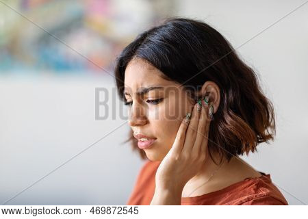 Ears Pain. Sick Young Arab Woman Suffering From Earache At Home