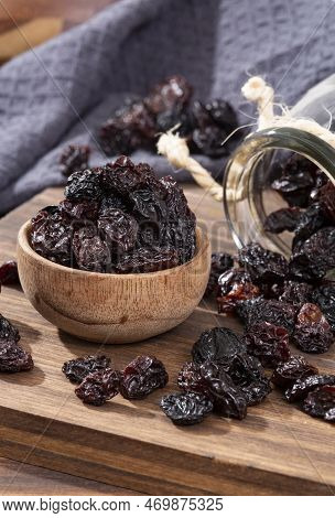 Healthy Food - Nuts Dehydrated Grapes; Photo On Wooden Background