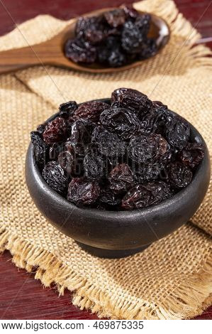 Healthy Food - Nuts Dehydrated Grapes; Photo On Wooden Background