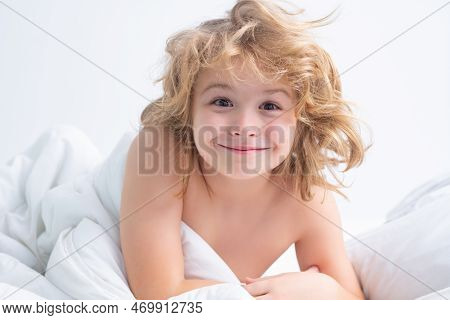 Good Morning. Little Funny Child Under Blanket In Bed, Just Wake Up.