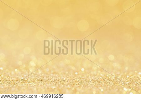 Christmas Golden Glowlight Glitter Blur Bokeh Abstract  Background.idea For Holiday Xmas And Happy N