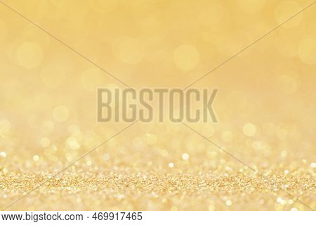 Christmas Golden Glowlight Glitter Blur Bokeh Abstract  Background.idea For Holiday Xmas And Happy N