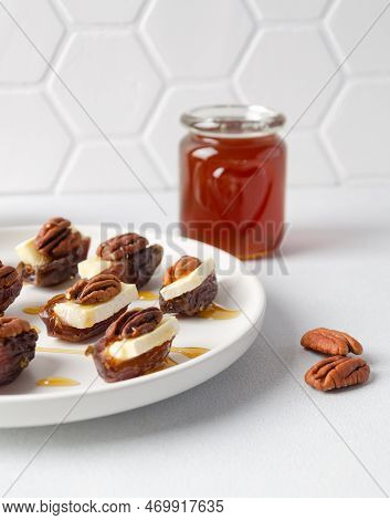 Snack Set (starters, Appetizers) With Dates, Brie Or Camambert Cheese, Pecan Nuts And Natural Organi