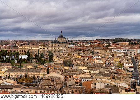 Toledo, Spain - Dec 01, 2022: View Of The Old City From The Alcazar, Royal Palace Over The Tagus Riv