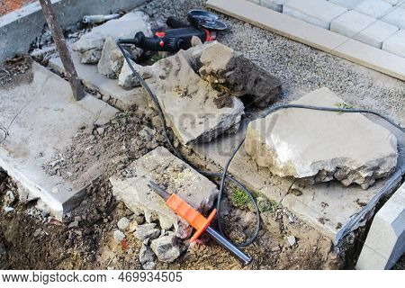 Defocus Paving Stones Paving Background. Installing Tools On Foreground. Many Big Paving Stone Block