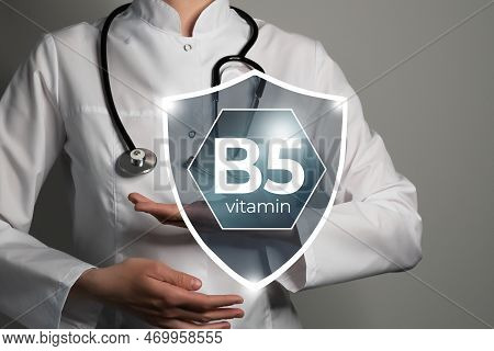 Molecular Model Of Vitamin B5, Niacin. Shield In Doctor`s Hands With Vitamin B5.