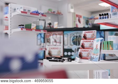 Cardiology Drugs Pacakages Standing On Table In Empty Drugstore, Pharmacy Equipped With Medical Inst