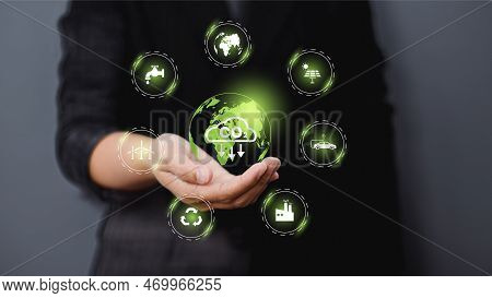 Hand Holding Virtual Global With Co2 Reducing Icon For Concept Of Decrease Carbon Dioxide Emission ,