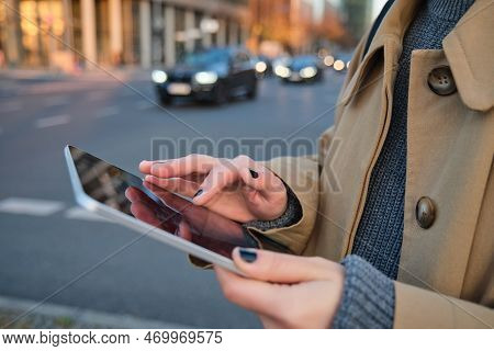 Close Up Photo Of Female Hands Holding Digital Tablet, Girl Looks At Screen, Checks Application, Sta