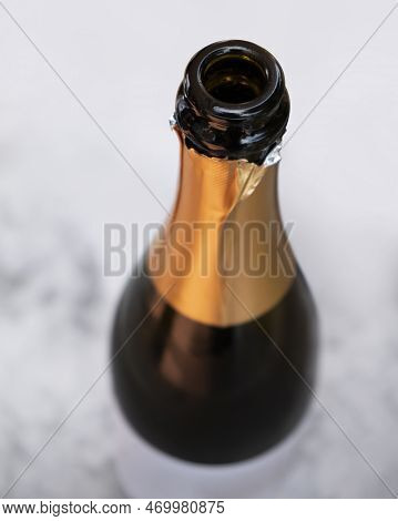 Open Champagne Bottle Seen From Above In Light Ambiance