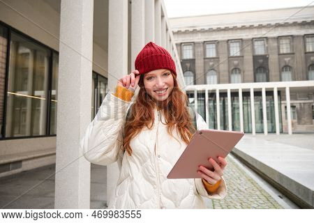 Stylish Ginger Girl, Tourist Walks With Digital Tablet Around City, Woman Connects To Iternet On Her