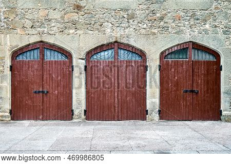 Brown Wooden Gates On Wall Surrounded By Stones In Medieval Design Hide Mysterious Things From Arriv