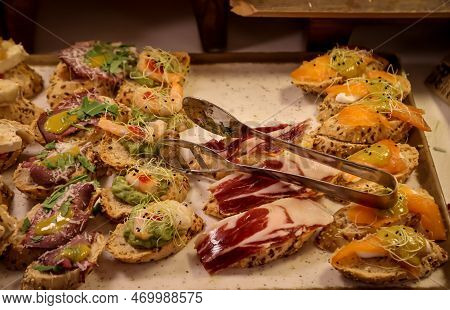 Many Bites With Cheese And Ham In A Tapas Bar.