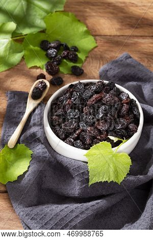 Healthy Food - Nuts Dehydrated Grapes; Photo On Wooden Background
