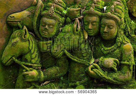 Ancient carvings covered with green moss