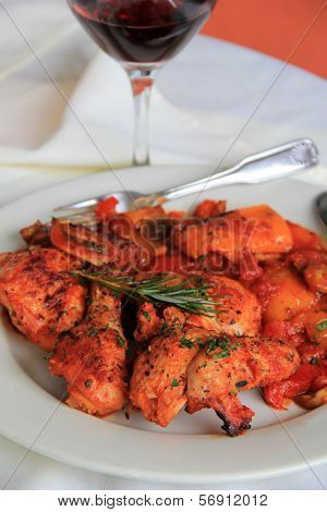 White dish with tender Chicken Cacciatore