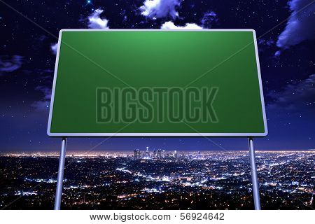 Direction Sign And Cityscape