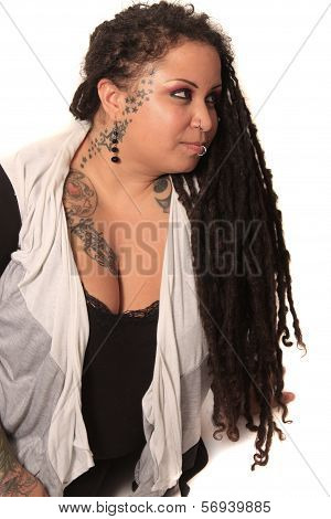 Tattooed Woman  With Piercings And Dreadlocks