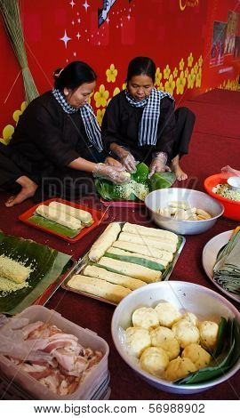 People With Traditional Vietnamese Dress Making Banhtet For  Lunar New Year