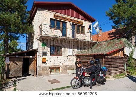 SARAJEVO, BOSNIA AND HERZEGOVINA - AUGUST 12, 2012: Tourists in front of Sarajevo Tunnel Museum. Constructed by the Bosnian Army during the war to link the city with the Bosnian-held territory.