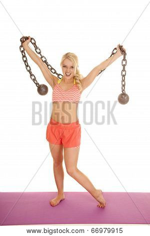 Blond Woman Orange Shorts Hold Up Ball And Chain