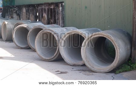 Many concrete pipes underconstruction by the road