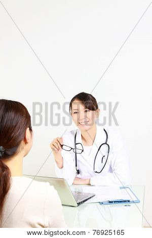 doctor talks to her patient