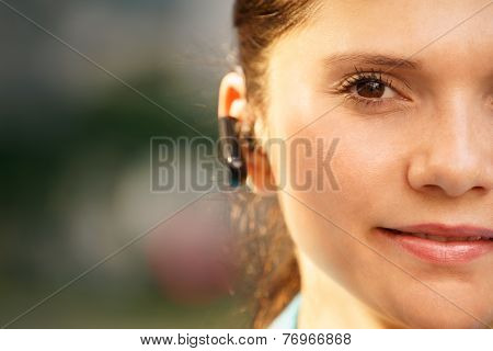 Business Woman With Phone Bluetooth Headset Smiling