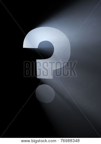 Question Mark. Hole cut in cardboard, smoke machine and spotlight. The image may appear noisy, but that is the texture of the smoke.