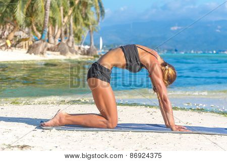 young beautiful happy smiling woman doing bodyflex, fitness, sport workout outdoors on natural background