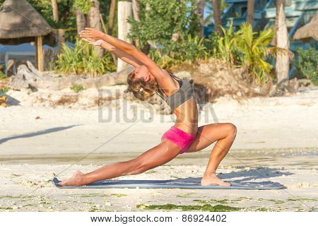 young beautiful happy smiling woman doing bodyflex, fitness, sport workout outdoors on natural background