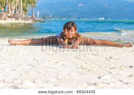 young beautiful happy smiling woman doing bodyflex, fitness, sport workout outdoors on natural background