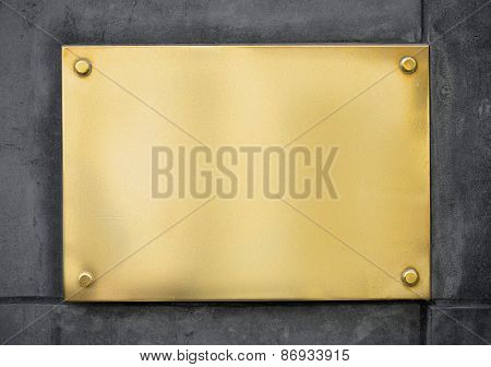 blank gold metal signboard or nameboard on wall