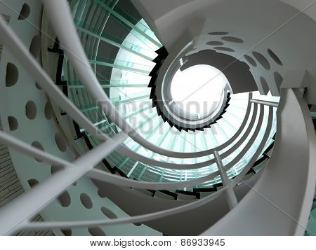 modern glass spiral staircase with metallic hand-rails.