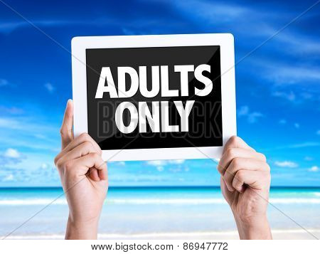 Tablet pc with text Adults Only with beach background