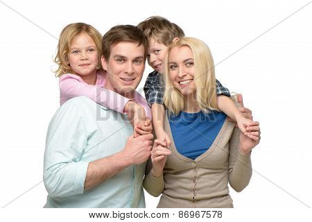 Smiling family of four enjoying time together