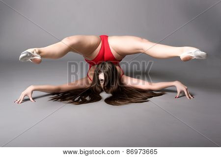 Young Female Contortionist, On Dark Background