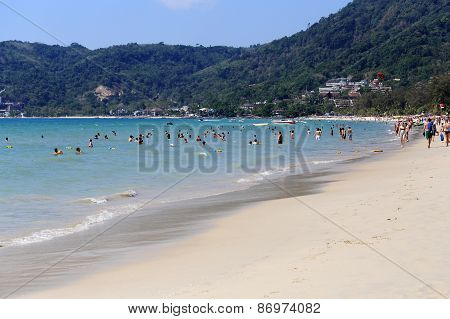 Rowds Of Tourists Vacation On A Beach During Their Christmas Holiday In Patong Beach