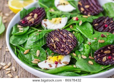 Fresh spinach salad, eggs and roasted beets