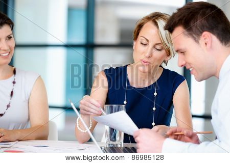 Businesswoman doing a presentaion in front of her collegues