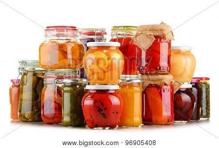 Jars With Pickled Vegetables And Fruity Compotes On White