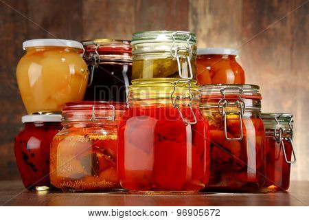 Jars With Pickled Vegetables And Fruity Compotes