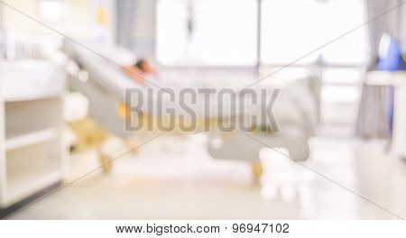 Blurred Image Of Patient With Drip In Hospital For Background Usage .