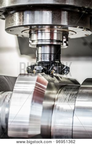 Metalworking CNC milling machine. Cutting metal modern processing technology. Small depth of field. Warning - authentic shooting in challenging conditions. A little bit grain and maybe blurred.