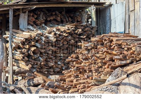 Abstract Background Of Stored Pieces Of Small Wood Ready For Heating, Chopped At Home In The Country