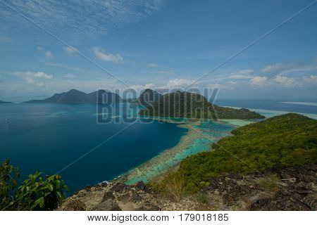 Beautiful tropical Bohey Dulang island with beach and blue water for relax